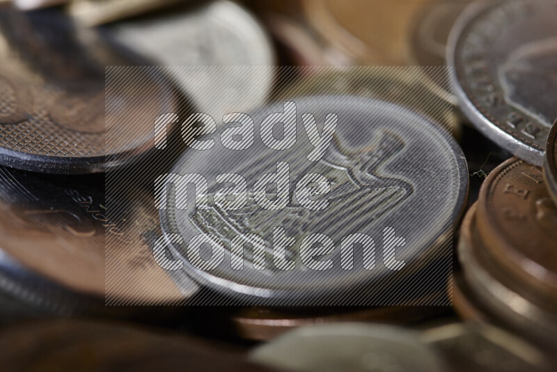 A close-ups of random old coins on black background