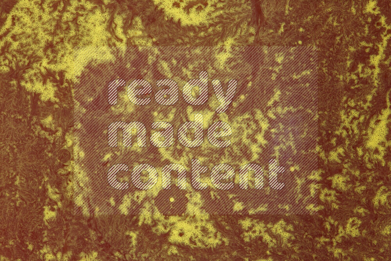 The image depicts a marbling effect with swirling patterns of red and yellow