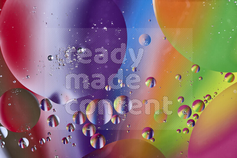 Close-ups of abstract oil bubbles on water surface in multicolors