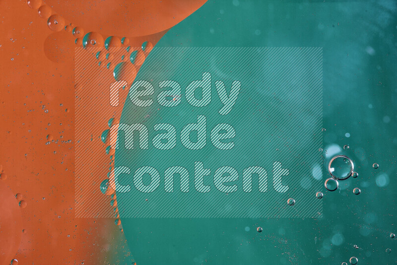 Close-ups of abstract oil bubbles on water surface in shades of green and orange