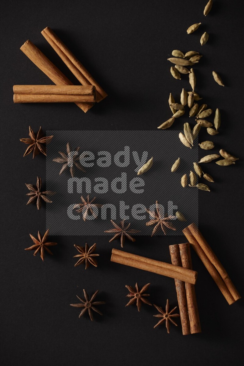 Cinnamon Sticks, Cardamom and star anise on a black background