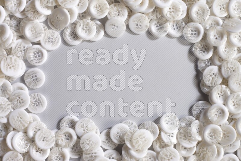 White buttons placed on grey background