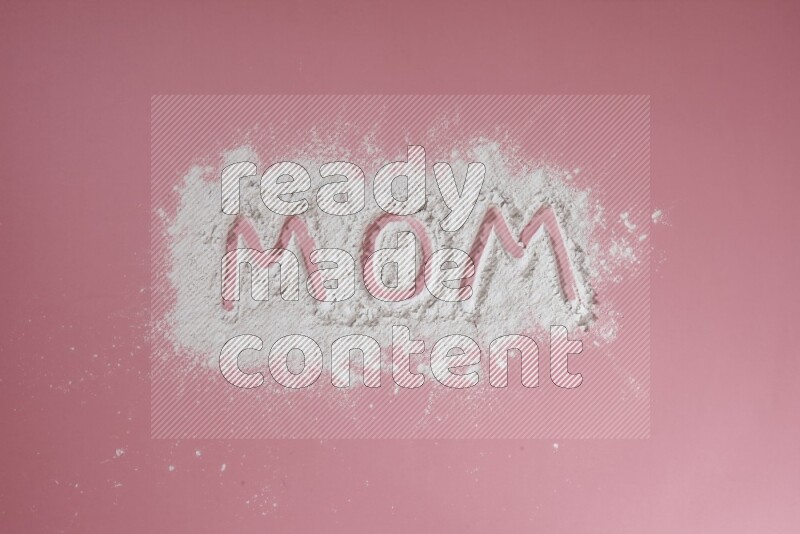 A word written with powder on pink background