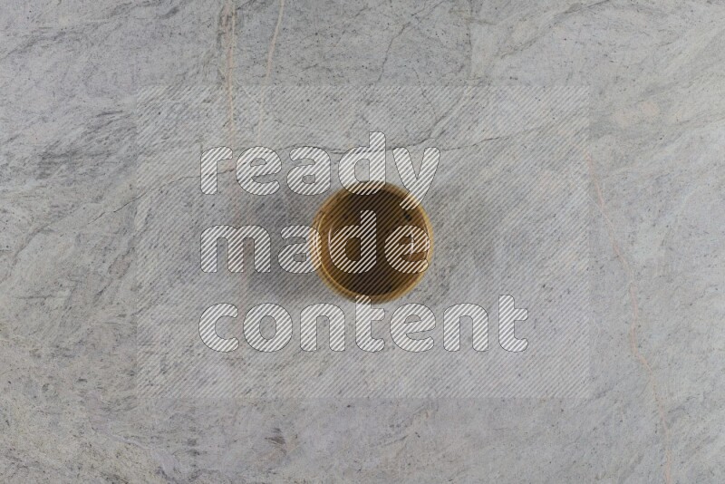 A multicolored pottery Bowl on grey marble background