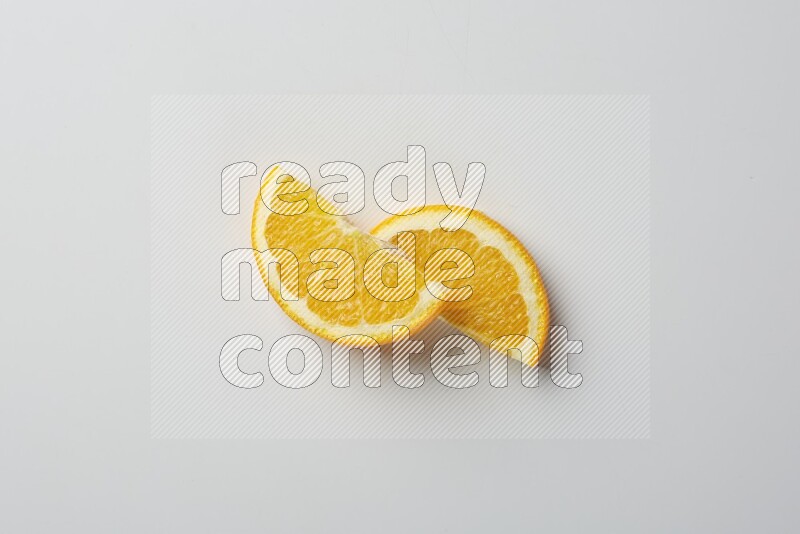 Two halves of an orange slices on white background