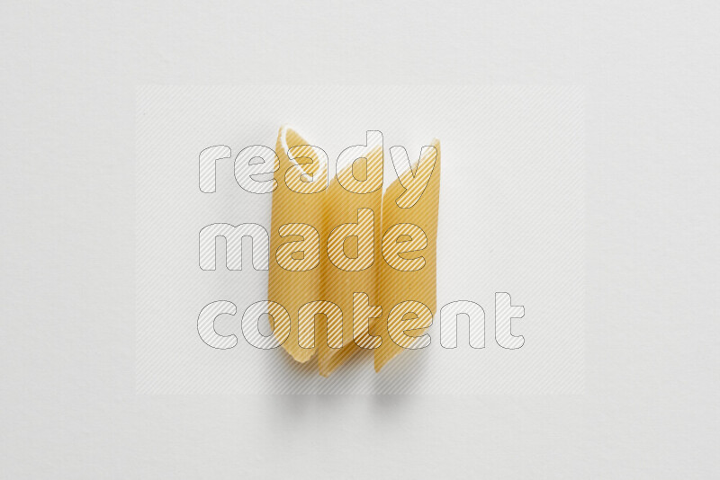 Penne pasta on white background
