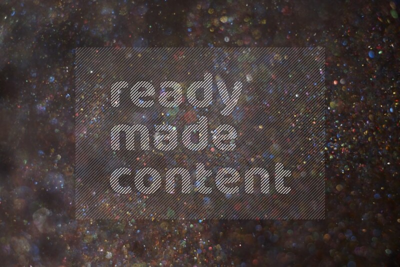 Multicolored glitter powder isolated on black background