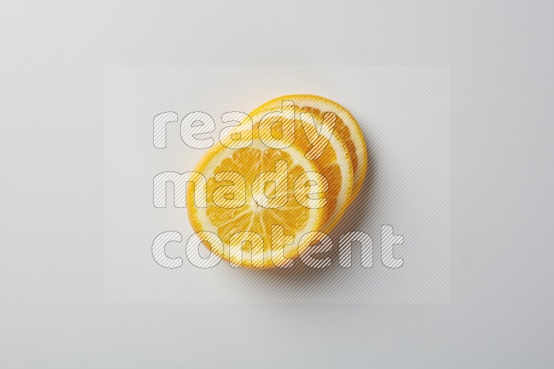 Three orange slices on a white background