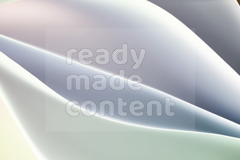 هذه الصورة تعرض تكوين فن الورق التجريدي مع منحنيات ورقية بتدرجات اللون الأخضر والأبيض المكونه بواسطة الضوء الملون