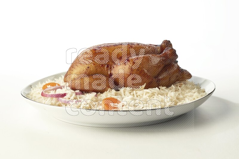 white  basmati Rice with  whole roasted chicken  on a white plate with a silver rim direct  on white background