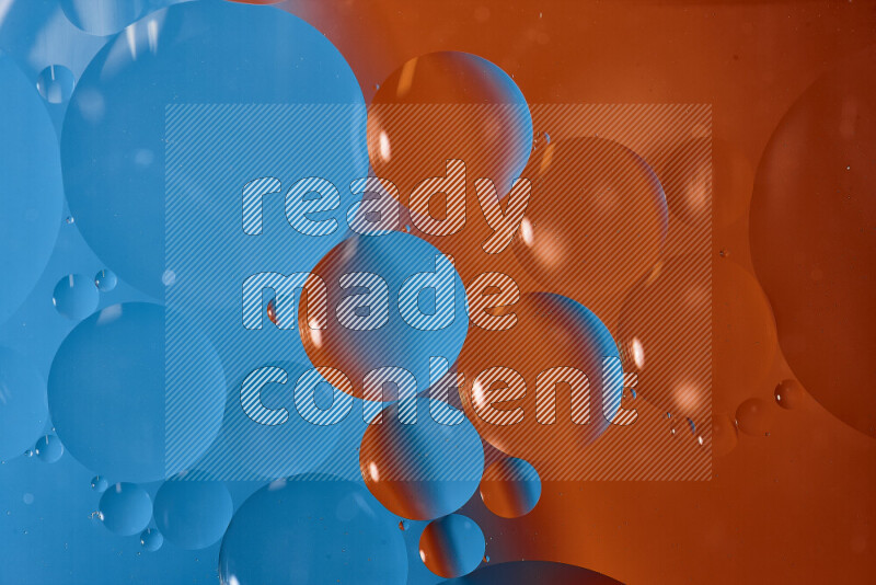 Close-ups of abstract oil bubbles on water surface in shades of blue and orange
