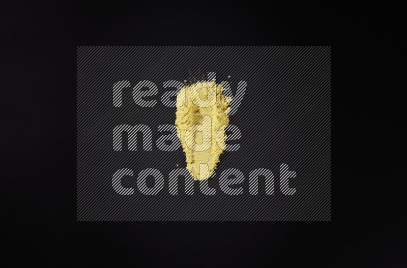 Yellow powder smears on black background