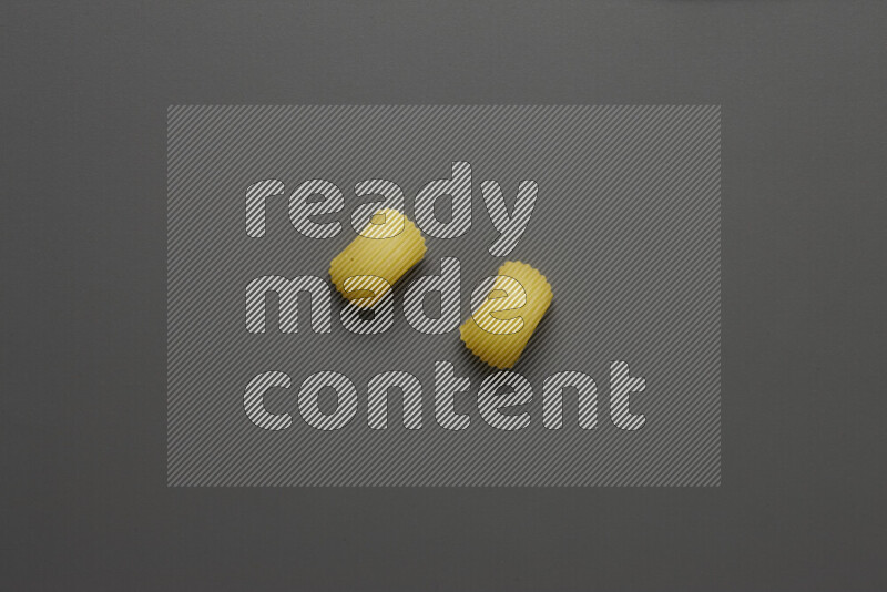 Elbow pasta on grey background