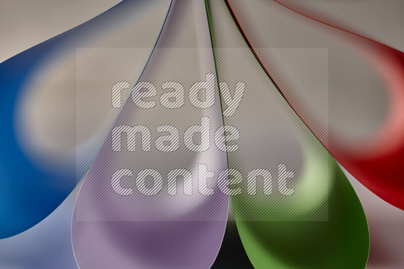 An abstract art showing colorful paper sheets arranged in an overlapping curves