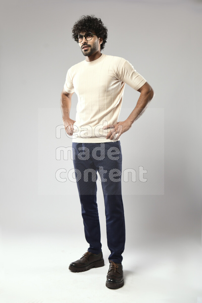 A man wearing casual standing and making a hand gesture on white background
