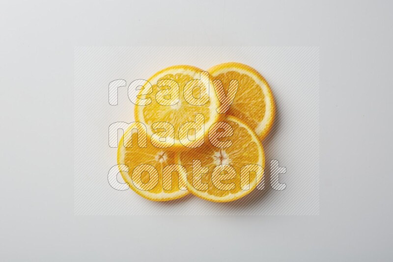 Four orange slices on a white background