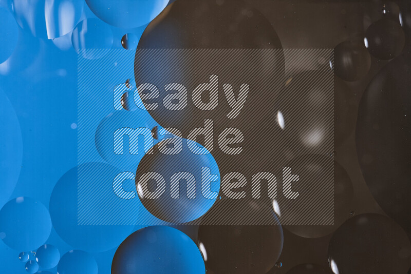 Close-ups of abstract oil bubbles on water surface in shades of blue and brown