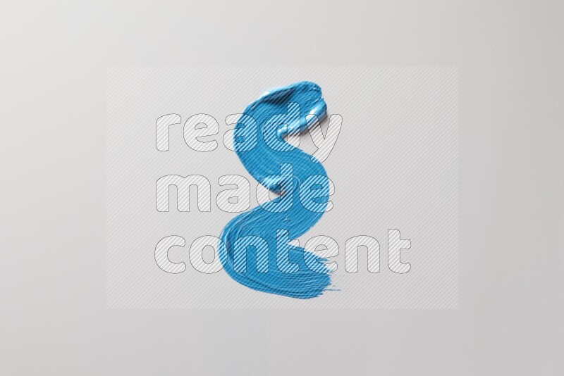 A single blue zigzag brush stroke on a white background