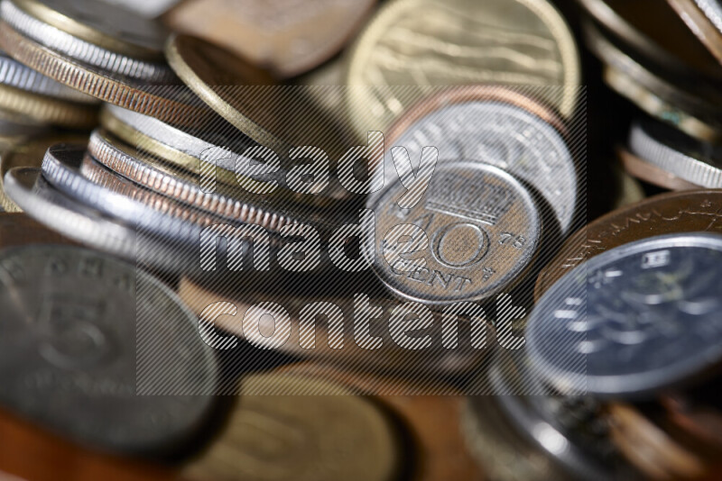 A close-ups of random old coins on black background