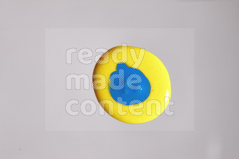 Close-ups of assorted colors blending on a grey background