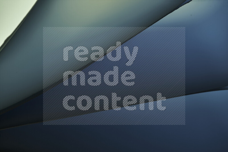 An abstract art piece displaying smooth curves in cold gradients created by colored light