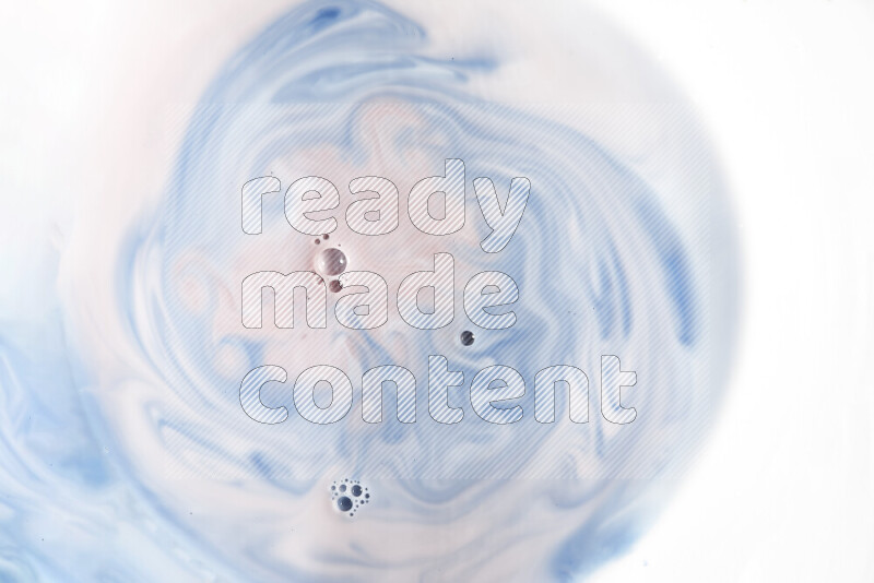 A close-up of abstract swirling patterns in blue, red and white