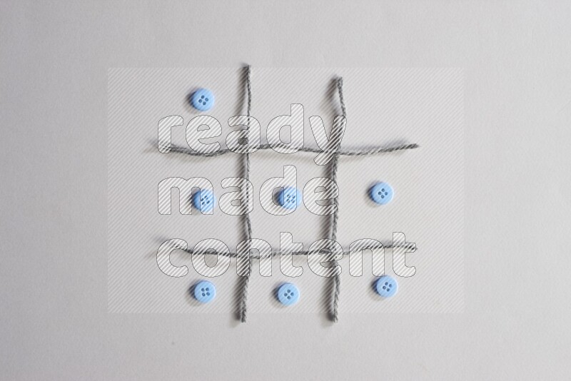 Blue buttons placed on grey background