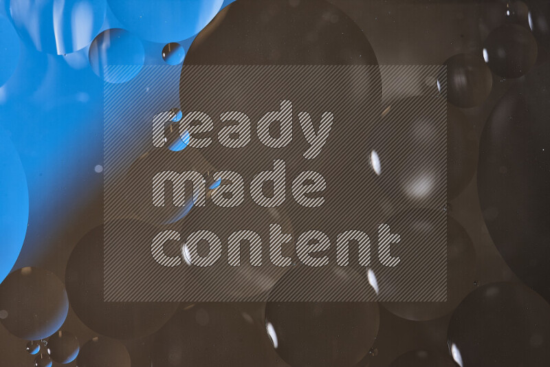 Close-ups of abstract oil bubbles on water surface in shades of blue and brown