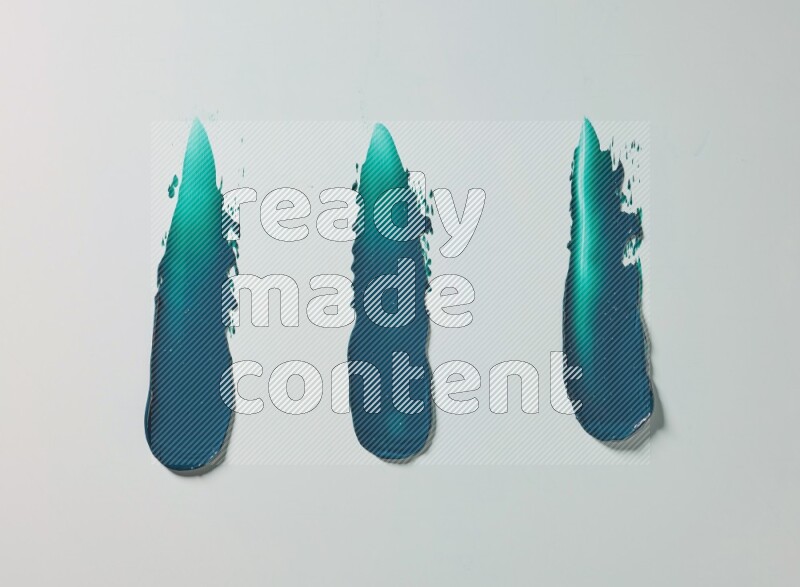 Turquoise painting knife strokes on white background