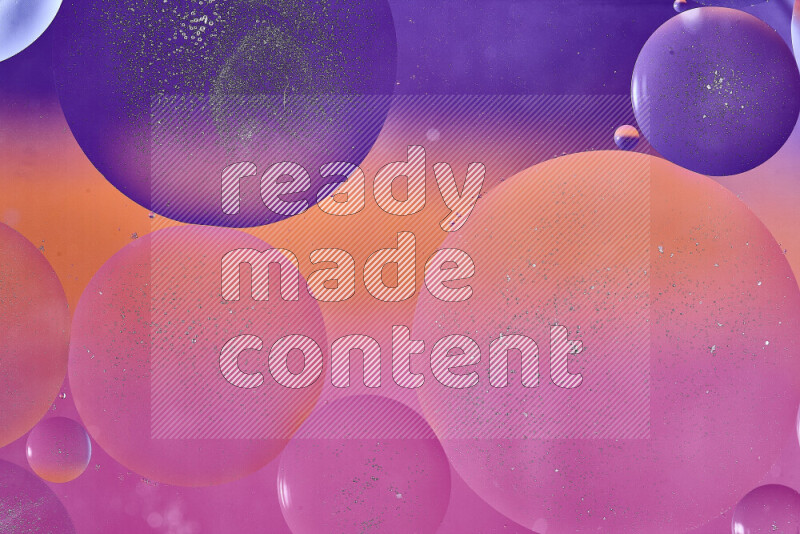 Close-ups of abstract oil bubbles on water surface in shades of purple, orange and pink