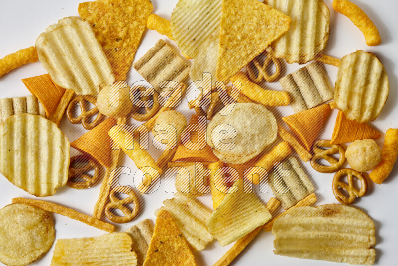 Assorted snacks on white background