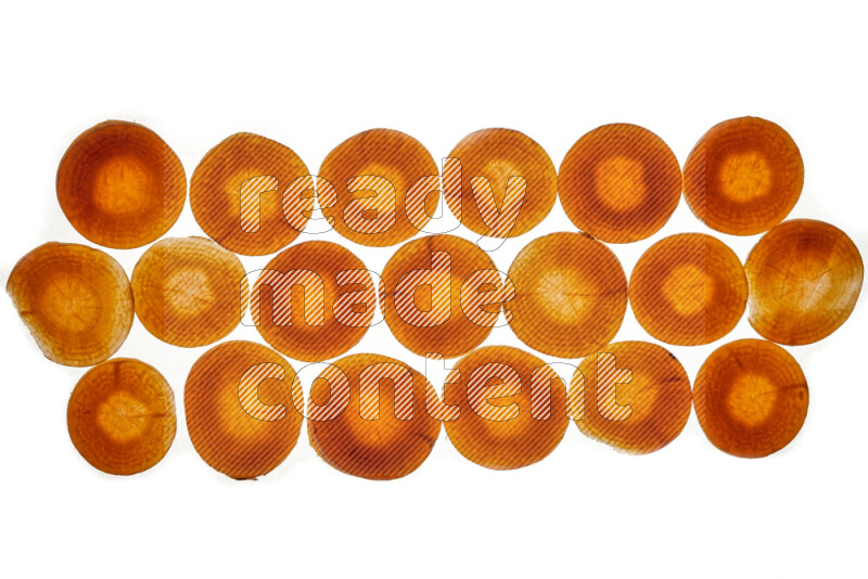 Carrots slices on illuminated white background