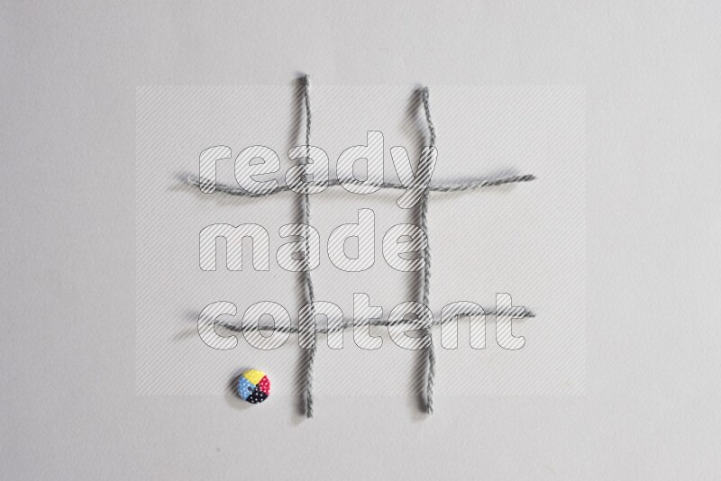 Multicolored buttons placed on grey background