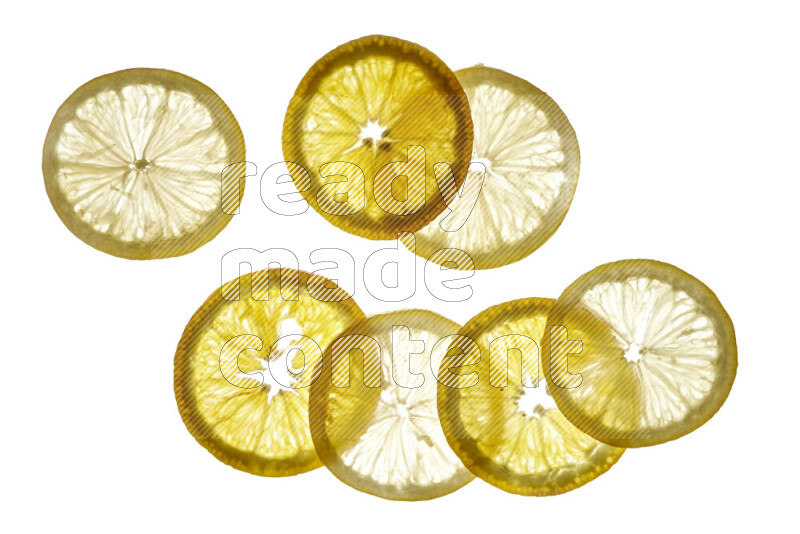 Mixed fruits slices on illuminated white background