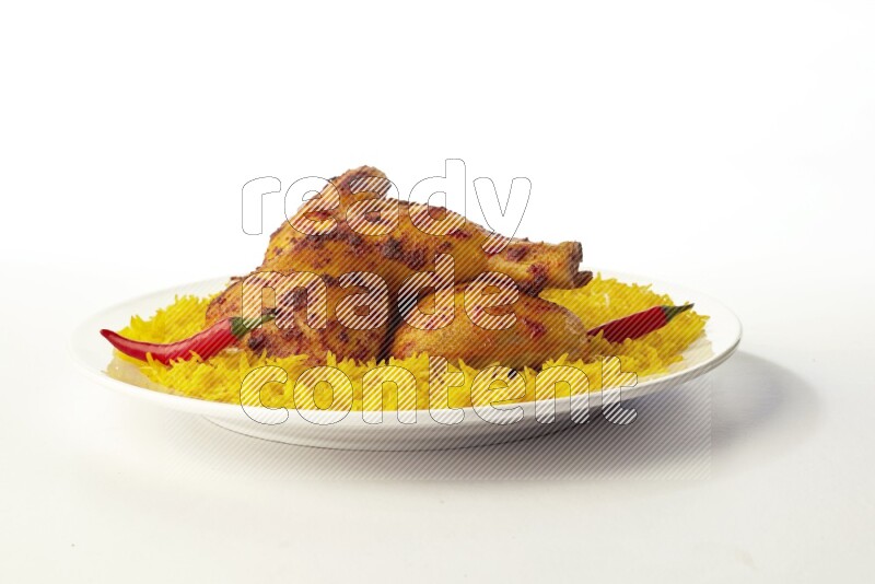 yellow basmati Rice with kabsa chicken pieces on a white rounded plate direct on white background