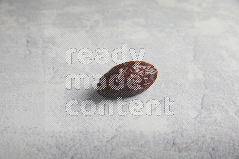 one madjoul date on a light grey background