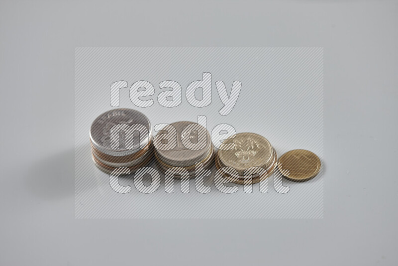 Random old coins on grey background
