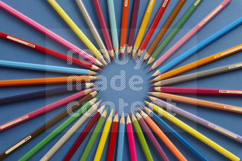 Different school supplies on blue background
