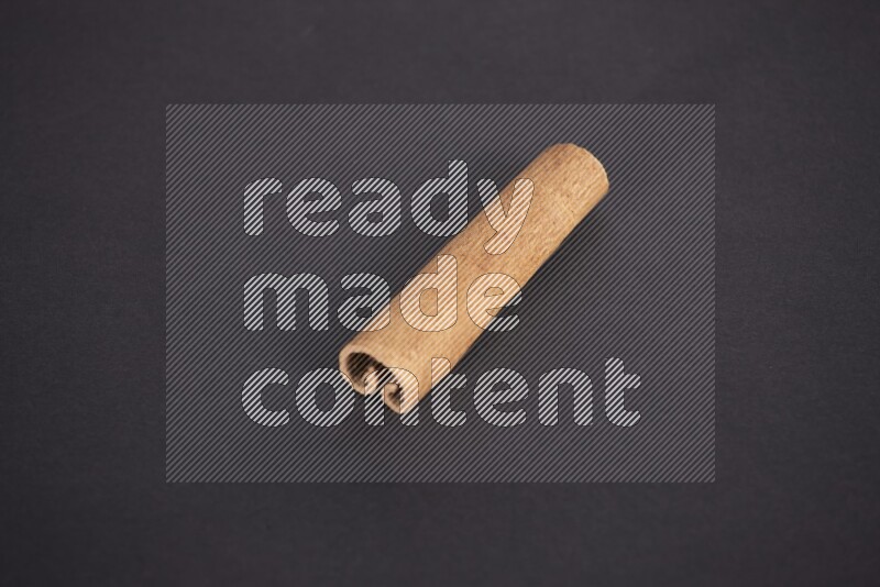 Cinnamon stick on black background