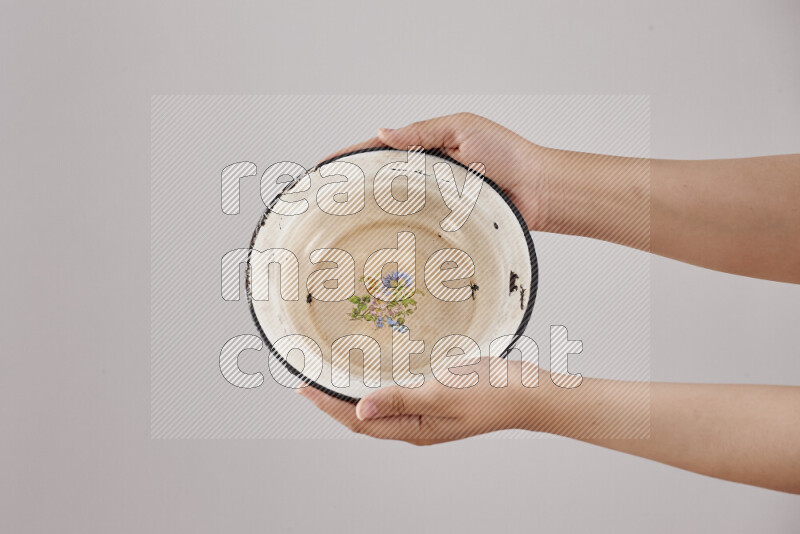 Woman hands holding different metal essentials in different positions