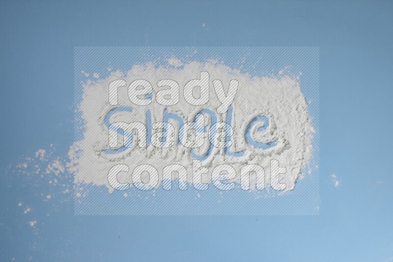 A word written with white powder on blue background
