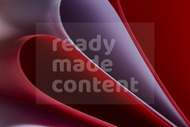 An abstract art showing purple and red paper sheets arranged in an overlapping curves