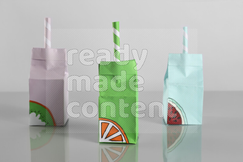 Origami juice box on grey background