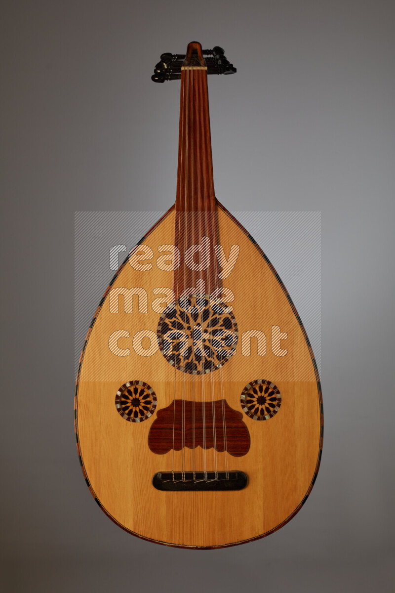 a wooden brown Oud on a gray background