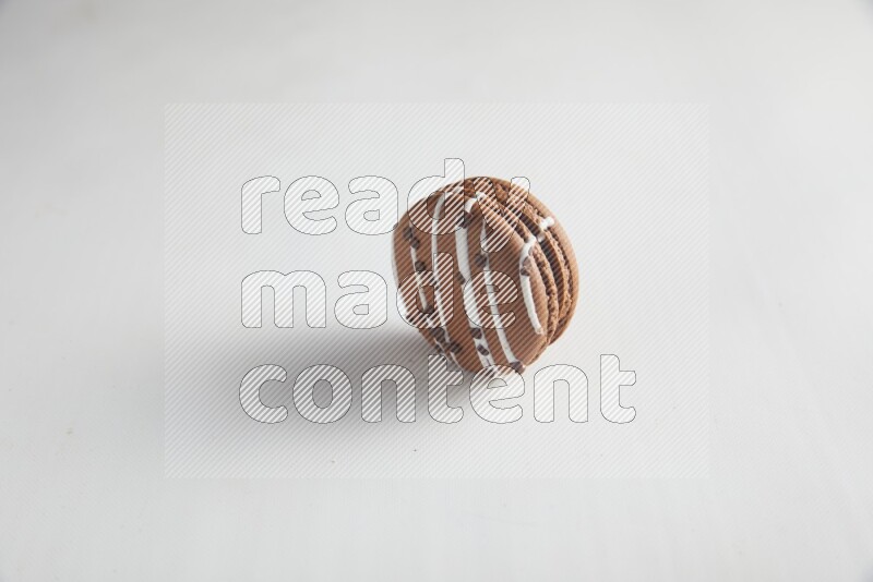 45º Shot of Brown white Chocolate Caramel macaron on white background