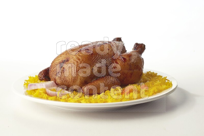 yellow  basmati Rice with  whole roasted chicken on a white rounded plate direct on white background