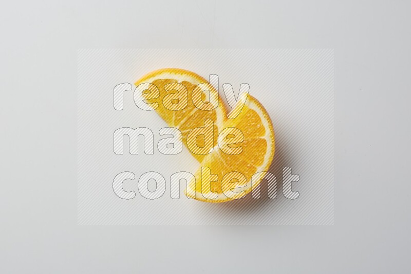 Two halves of an orange slices on white background
