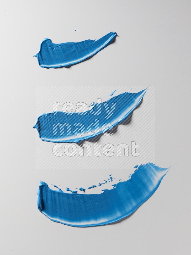 Blue painting knife strokes on white background