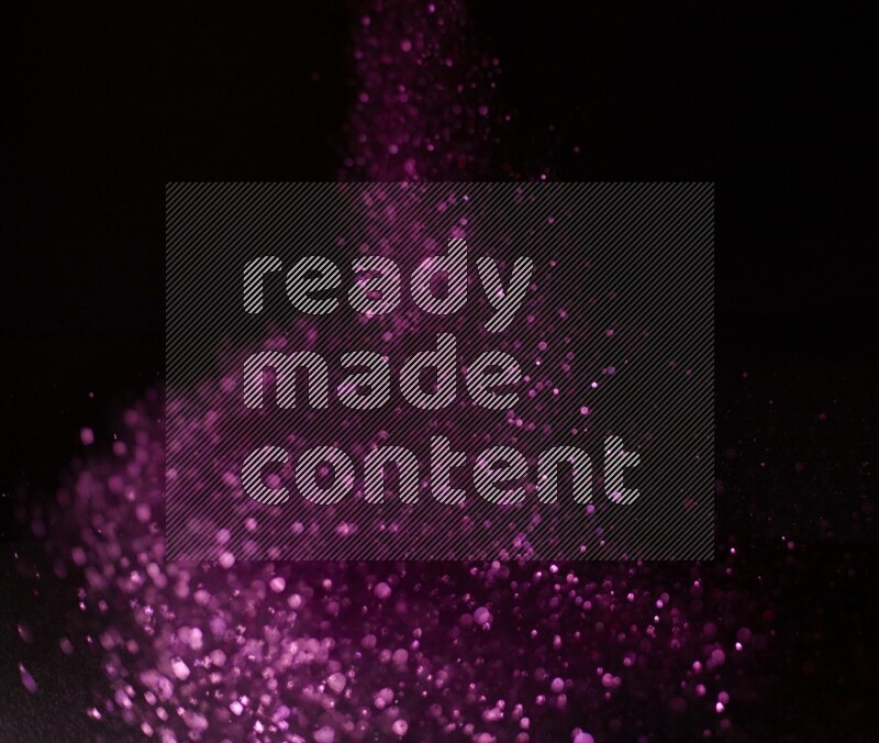 Pink glitter powder isolated on black background