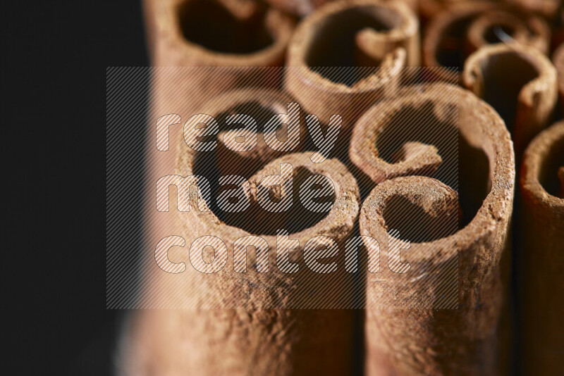 Cinnamon sticks on black background